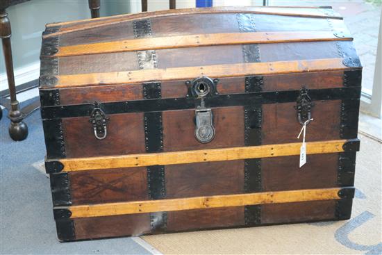 A wood and leather bound dome top steamer trunk W.92cm